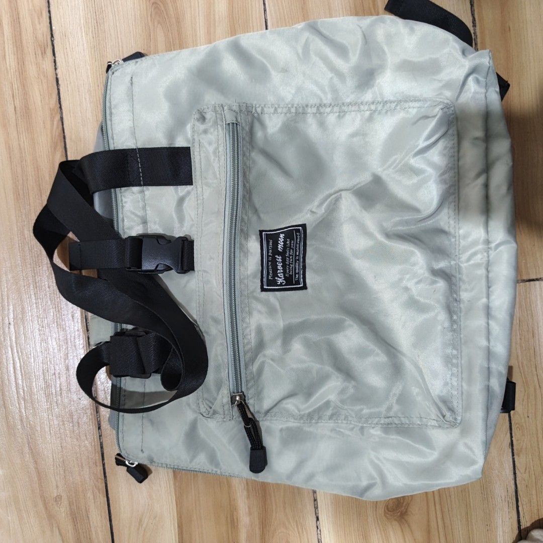 Harvest Moon Tote Bag (Category: Tote Bags) located in Manila. Submitted by narju1234 (Listing ID 1461125107, Image 2). Description: - Light grey tote bag from Harvest Moon - Front zip pocket for easy access - Main compartment with secure drawstring closure - Versatile: can be carried as a tote or worn as a backpack - Adjustable straps for comfortable wear - Ideal for everyday errands or travel adventures.