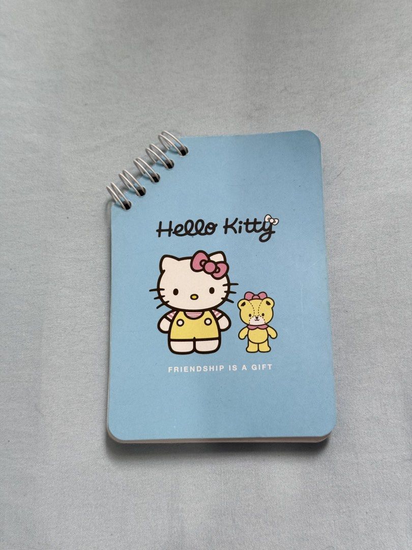 Hello Kitty Spiral Notebook (Category: Stationery & School Supplies) located in Las Pinas. Submitted by cherrichigo (Listing ID 1461153923, Image 1). Description: - Light blue Hello Kitty small notebook - Spiral bound for easy page laying - Blank pages inside for notes or drawings - Ideal for school or personal use Delivery only Location: Las Piñas.