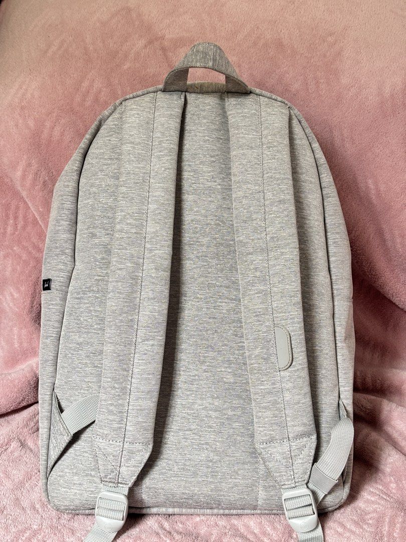 Herschel Heritage Backpack (Category: Backpacks) located in Quezon City. Submitted by nanas_closet756 (Listing ID 1461167066, Image 2). Description: - Brand: Herschel Supply Co. - Color: Grey Heather - Style: Classic backpack - Features: Front zip pocket, spacious main compartment - Comfort: Padded shoulder straps - Ideal for: School, everyday use - Design: Simple and functional.