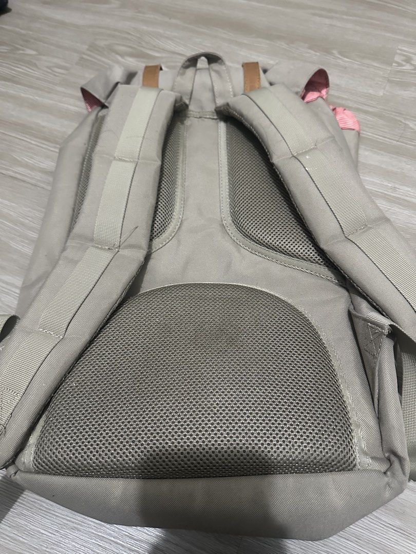 Herschel Supply Co. Backpack Grey Tan Straps (Category: Backpacks) located in Manila. Submitted by oddcrystal_0a3d5b (Listing ID 1461294543, Image 3). Description: - Classic Herschel backpack in grey canvas - Tan faux leather straps with buckle closures - Padded mesh back and shoulder straps for ultimate comfort - Convenient front pocket with buckle closure - Subtle pink stripe detail on top flap - Ideal for school, work, or everyday carry.