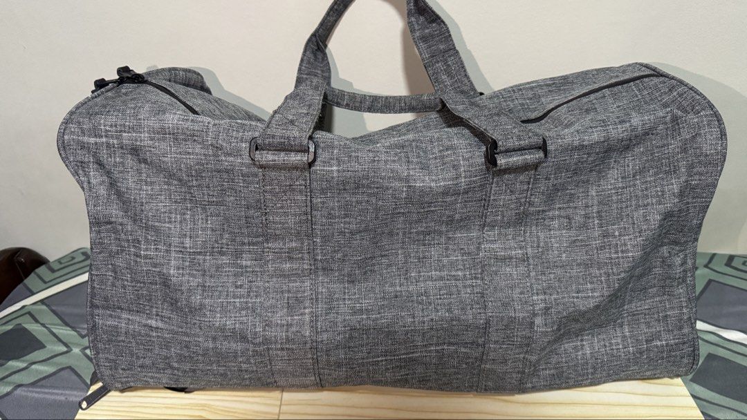 Herschel Supply Co. Grey Duffle Bag (Category: Sling Bags) located in Manila. Submitted by cecececce (Listing ID 1461124358, Image 3). Description: Duffel Bag Novel Duffle Mid-Volume - Raven Crosshatch - like new, no scratches or torn fabric - zipper still easy to use - Grey Herschel duffel bag - Ideal for weekend trips or gym sessions - Includes top handles and a detachable shoulder strap - Secure zipper closure - Made with durable material - Sp