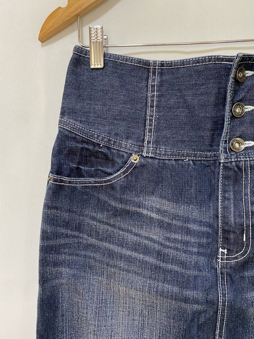 High Waisted Denim Skirt with Button Fly (Category: Skirts) located in Cavite. Submitted by cheonsa_sells (Listing ID 1461274229, Image 2). Description: - Dark wash denim skirt - High-waisted with button fly closure - Knee-length with a subtle back slit - Classic five-pocket design - Estimated size: Medium to Large - Ideal for casual outfits.