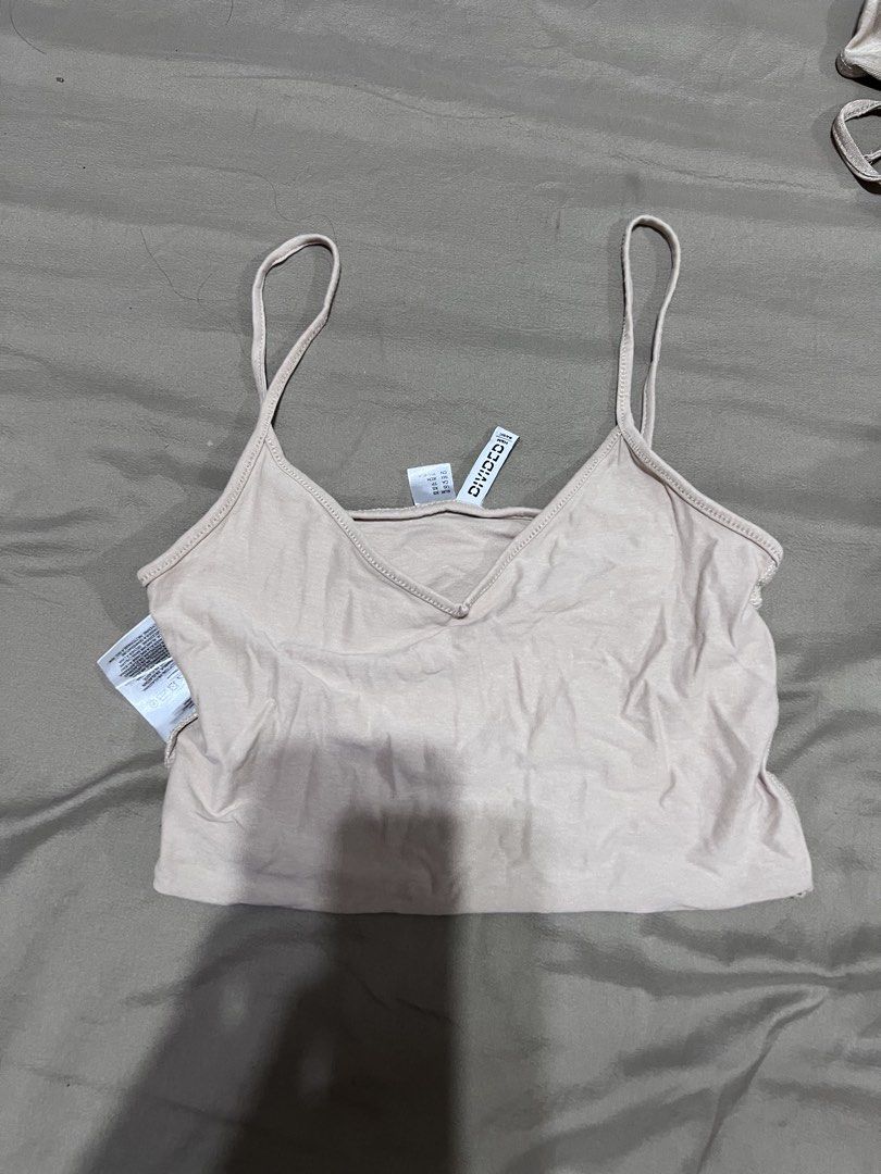 H&M Divided Basic Crop Top (Category: Shirts) located in Quezon City. Submitted by jinnysells (Listing ID 1461276269, Image 1). Description: - Brand: H&M Divided - Style: Basic Crop Top - Neckline: V-neck - Straps: Thin - Condition: New with tags - Features: Comfortable, versatile for layering or solo wear - Occasion: Casual outfits.