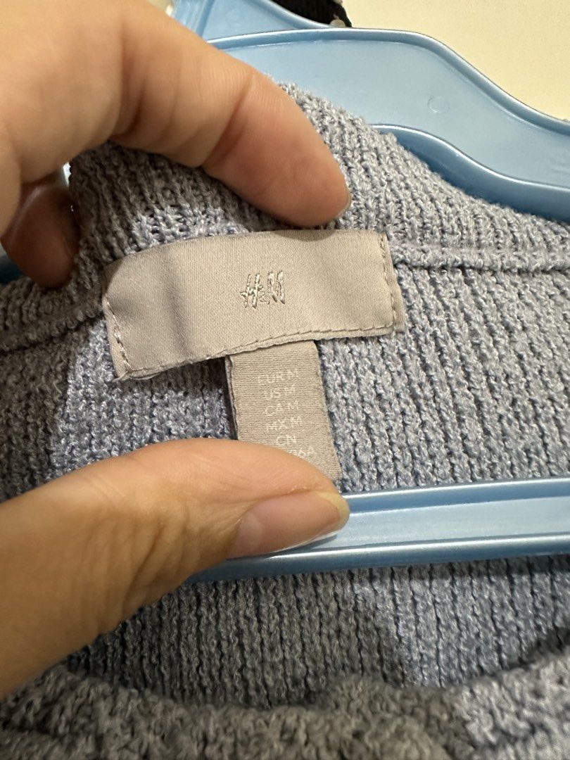 H&M Light Blue Textured Button-Up Cardigan (Category: Coats, Jackets and Outerwear) located in Manila. Submitted by itsyourgirlmc (Listing ID 1461287474, Image 2). Description: - Light blue textured cardigan from H&M - Round neckline - Silver button closures - Two faux pocket details - Cropped length - Ideal for layering over tops or dresses - Comfortable knit material.