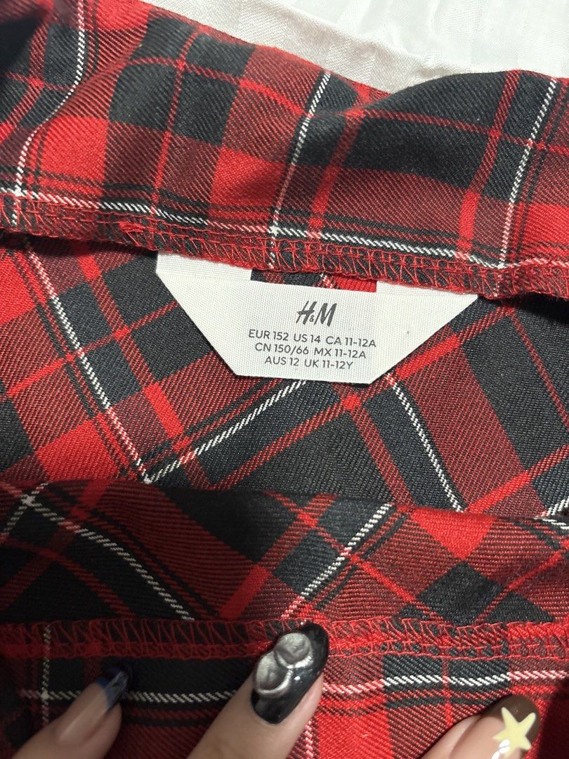 H&M Red Plaid Skirt (Category: Skirts) located in Pasay City. Submitted by nicoletlntn_ (Listing ID 1461236022, Image 2). Description: - H&M Red & Black Plaid Skirt - Kids Size 14 (fits 11-12 years old) - Versatile: Great for casual days or dressing up - Easy to pair with various tops - Check label for precise sizing.