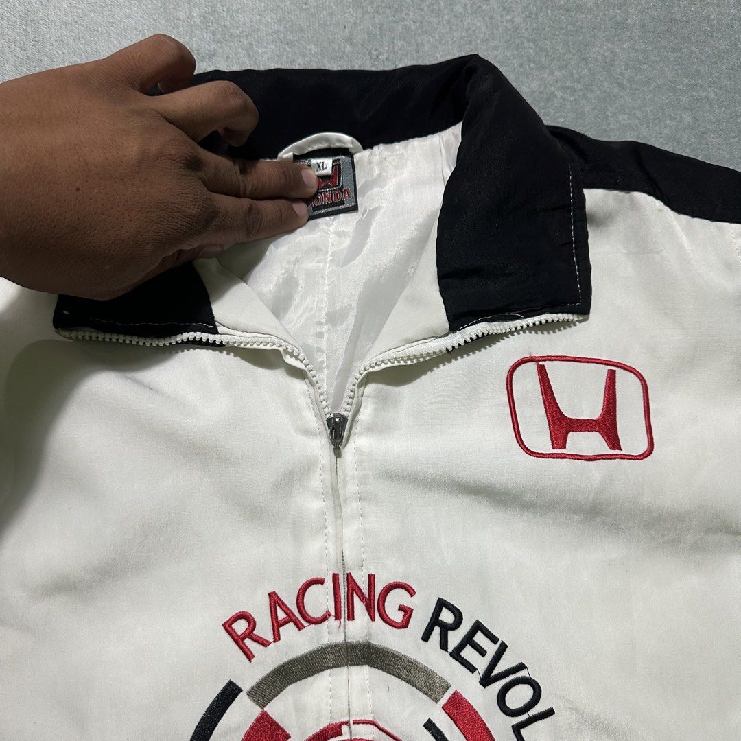 Honda Racing Revolution Bomber Jacket (Category: Coats, Jackets and Outerwear) located in Bayombong. Submitted by rochelle_archive_garments (Listing ID 1461323049, Image 3). Description: - Cool Honda racing jacket - 'Racing Revolution' graphic on front - Honda logos on chest and sleeves - Black and white colorway with red accents - Zipper closure - Estimated size: XL - Ideal for Honda enthusiasts.