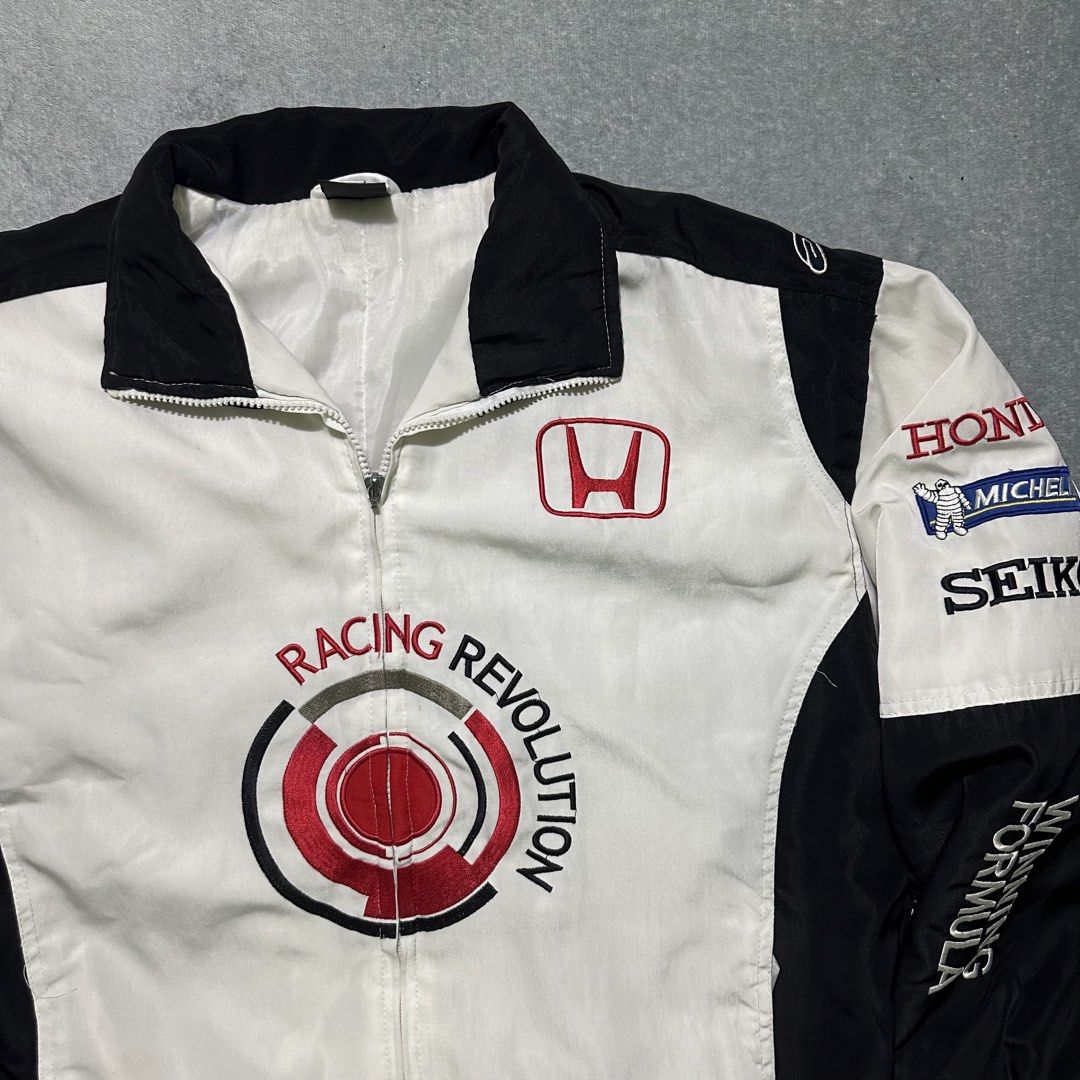 Honda Racing Revolution Bomber Jacket (Category: Coats, Jackets and Outerwear) located in Bayombong. Submitted by rochelle_archive_garments (Listing ID 1461323049, Image 2). Description: - Cool Honda racing jacket - 'Racing Revolution' graphic on front - Honda logos on chest and sleeves - Black and white colorway with red accents - Zipper closure - Estimated size: XL - Ideal for Honda enthusiasts.