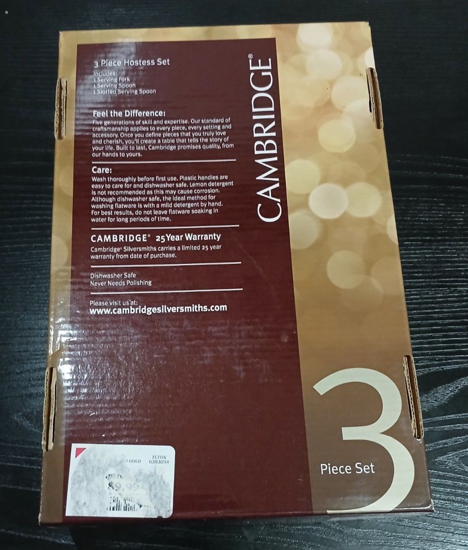Hostess Set (Category: Other Kitchenware & Tableware) located in Davao. Submitted by ferdipt (Listing ID 1461126300, Image 2). Description: A Cambridge Hostess Set featuring three stainless-steel utensils with gold glitter-filled acrylic handles. This 3-piece hostess set includes a serving spoon, a serving fork, and a smaller spoon, all presented in a branded box. The handles have a textured, sparkling gold glitter design encased in clear acrylic