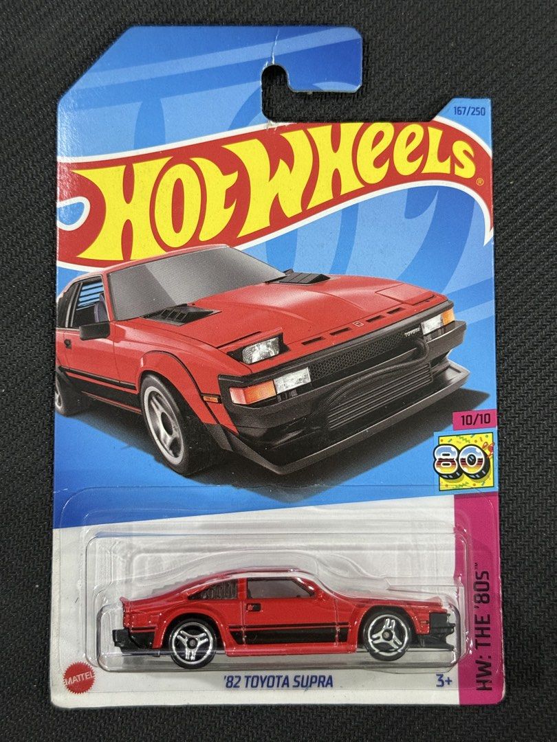 Hot Wheels '82 Toyota Supra (Category: Vehicle & Diecast Models) located in Muntinlupa City. Submitted by eman_garcia_ (Listing ID 1461318850, Image 1). Description: - Hot Wheels '82 Toyota Supra (Red) - Part of the HW The 80s series - Collection number: 167 out of 250 - Brand new, sealed in original packaging - Ideal for die-cast car collectors.