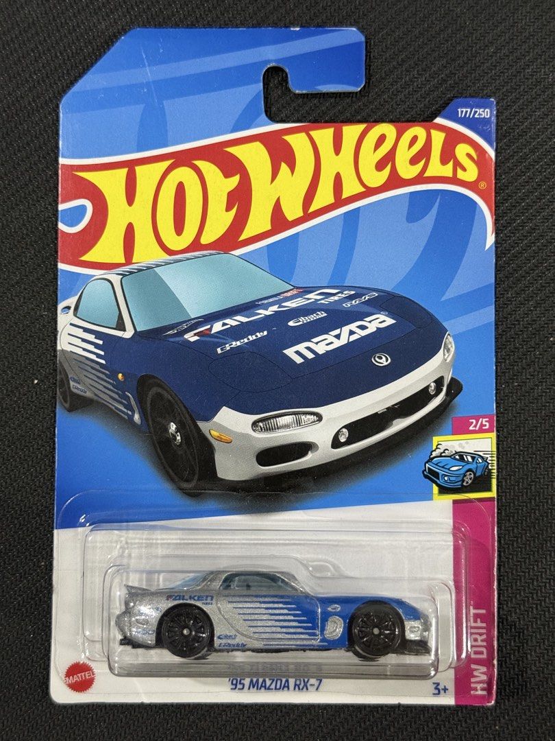 Hot Wheels '95 Mazda RX-7 (Category: Vehicle & Diecast Models) located in Muntinlupa City. Submitted by eman_garcia_ (Listing ID 1461318214, Image 1). Description: - Hot Wheels '95 Mazda RX-7 - From the HW Drift series - Features iconic blue and silver Falken livery - Card number 177 out of 250 in the collection - A must-have for any Hot Wheels enthusiast or collector.