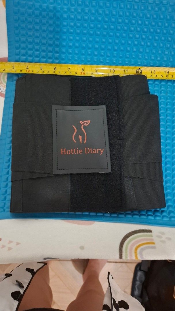 Hottie Diary Waist Trainer Belt (Category: Undergarments & Loungewear) located in Paranaque City. Submitted by nylahtan (Listing ID 1461297572, Image 1). Description: - Brand: Hottie Diary - Color: Black - Type: Waist Trainer Belt - Closure: Adjustable velcro for a snug fit - Benefits: Helps with posture and shaping - Ideal for: Post-partum recovery or everyday wear - Dimensions: Approximately 11 inches in height.