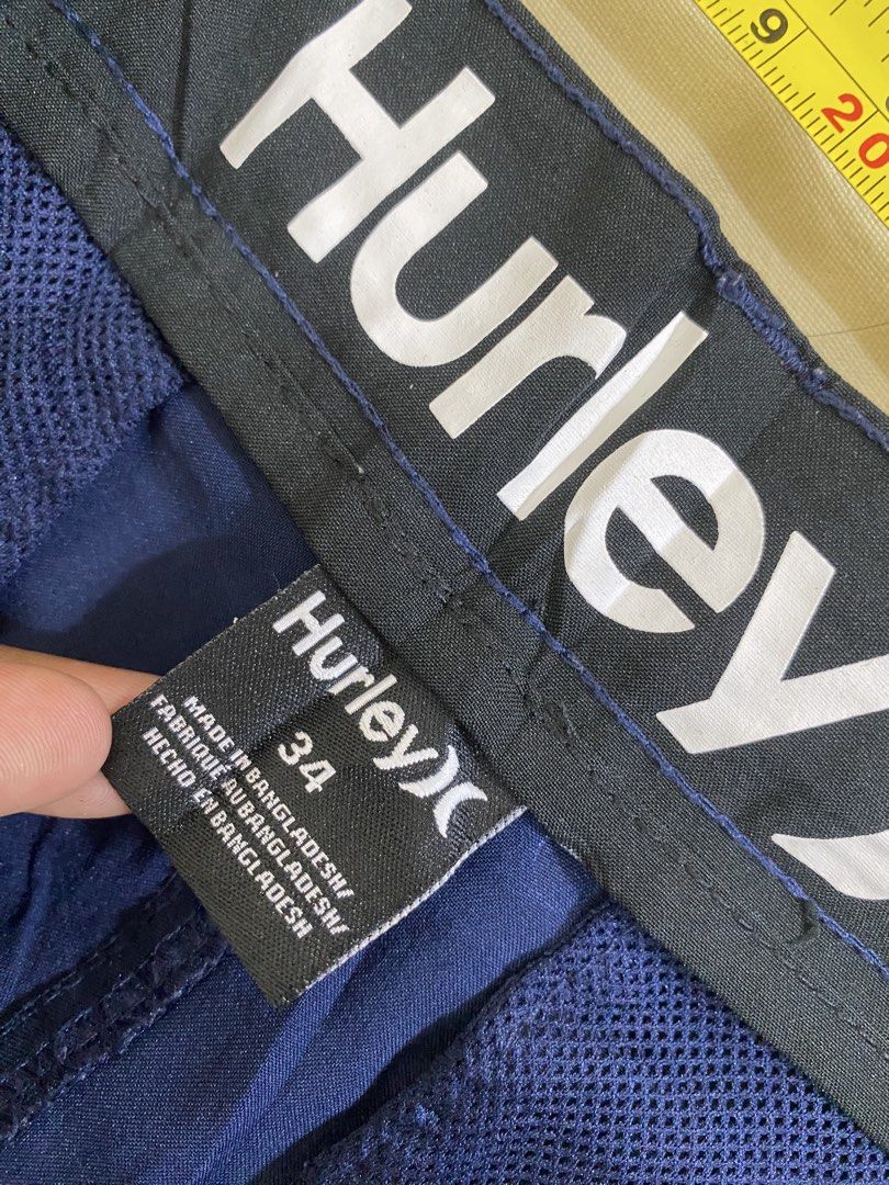 Hurley Navy Blue Shorts Size 34 (Category: Shorts) located in Manila. Submitted by carbertjakosalem (Listing ID 1461311118, Image 2). Description: - Navy blue Hurley shorts - Size 34 - Hurley logo on leg and waistband - Made in Bangladesh - Ideal for casual wear or sports.
