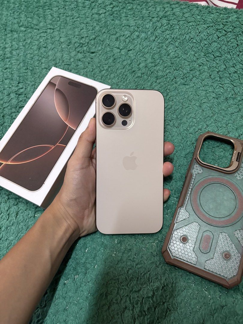 Iphone 16 Pro Max (256GB Desert Titanium) (Category: Cases & Sleeves) located in Quezon City. Submitted by iamgrei (Listing ID 1461232875, Image 2). Description: ‼️Pass to lowballers‼️ iPhone 16 pro max, 256gb storage 95 battery health, Openline honest flaw: may dark spot sa 0.5 and macro mode , no other issue. Comes with unit, tempered glass, case, replacement box, manuals and sim pin, and unused cord Meet up: Sm north or Munoz.
