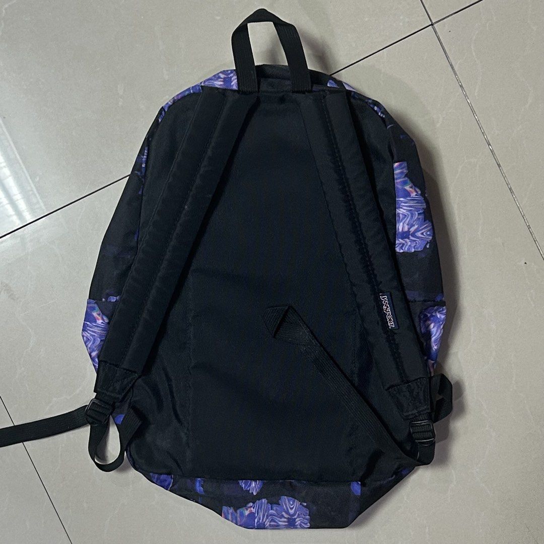 Jansport Backpack - Floral Print (Category: Backpacks) located in Quezon City. Submitted by stlntno095 (Listing ID 1461143625, Image 2). Description: - Unique purple and black print design Jansport backpack - Spacious main compartment for all your essentials - Convenient front zip pocket for quick access items - Adjustable straps for a comfortable fit - Ideal for school, work, or everyday adventures.