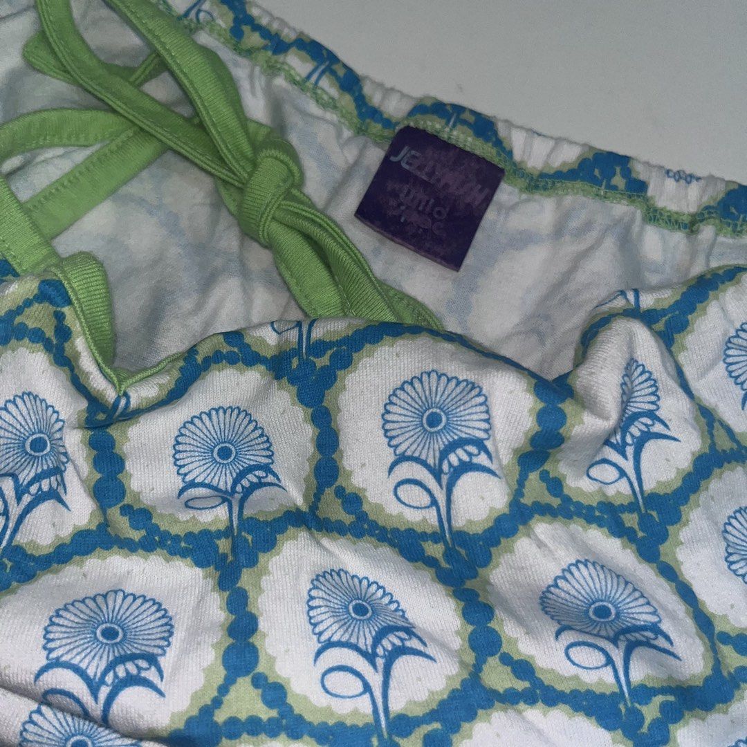 Jellymallow Blue Floral Tank Top (Category: Sleeveless) located in Makati City. Submitted by midnightmelhem (Listing ID 1461146037, Image 3). Description: - Cute blue floral print tank top - Green trim and tie straps at the back - Brand: Jellymallow Kids - Perfect for casual wear or layering - Soft and comfortable fabric.