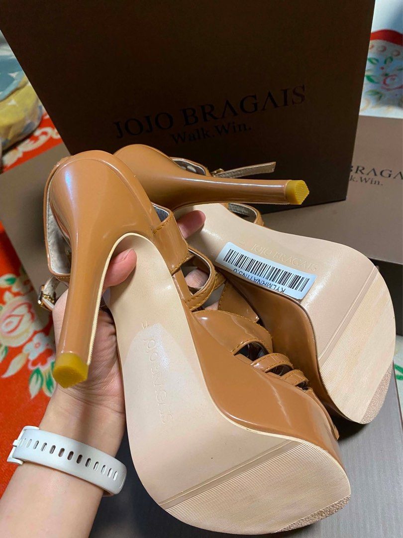 JOJO BRAGAIS Maxine in Morena (Category: Heels) located in Manila. Submitted by jsanpascua11259 (Listing ID 1461277427, Image 2). Description: - Brand: JOJO BRAGAIS - Style: Tan Platform Heels - Material: Patent Leather - Features: Cut-out details, Ankle strap with buckle closure - Includes: Original box - Size 11 - Occasion: Great for dressing up.