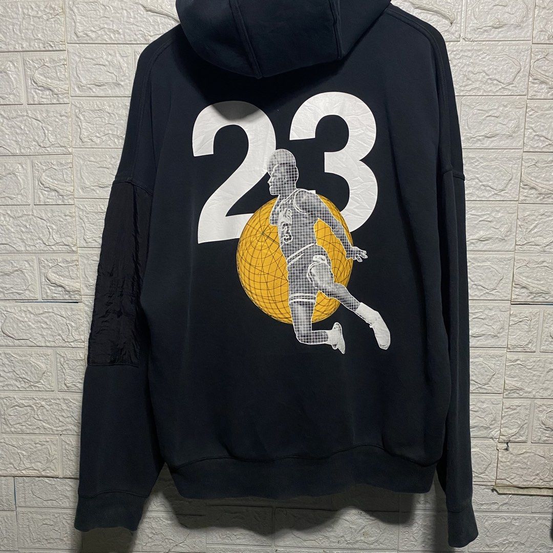 Jordan Engineered For Flight SP/21 Black Hoodie (Category: Coats, Jackets and Outerwear) located in Naga. Submitted by thesource4400 (Listing ID 1461291895, Image 2). Description: - Authentic Black Jordan hoodie from the SP/21 collection. - Front features 'Engineered For Flight' graphic and Jumpman logo. - Back showcases a large '23' graphic with Michael Jordan in action. - Convenient zippered pockets on the sleeves. - Designed for comfort and st