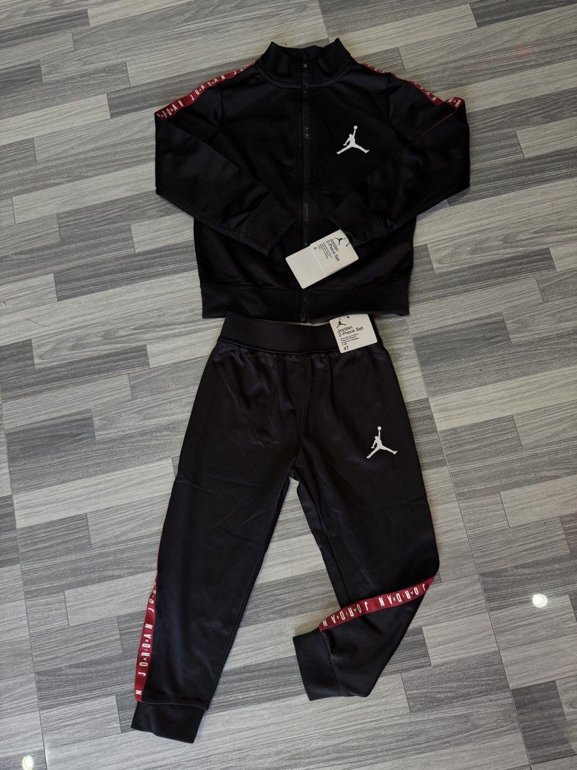 Jordan Toddler Tracksuit Black (Category: Babies & Kids Fashion) located in Manila. Submitted by zgrey12 (Listing ID 1461133794, Image 1). Description: - Black Jordan tracksuit for toddlers - Iconic Jumpman logo on jacket and pants - Red and white Jordan branding on sleeves and pant legs - Full zip jacket with stand-up collar - Pants with elastic waistband - Ideal for active little ones.