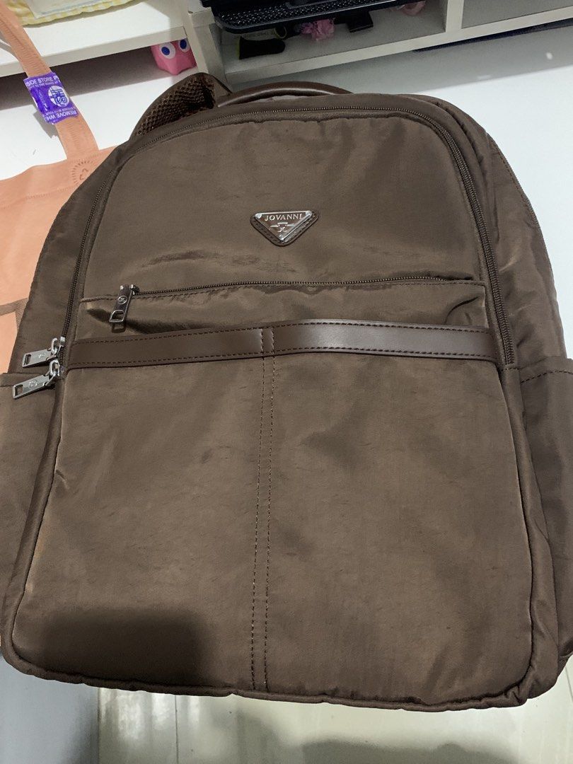JOVANNI Brown Backpack (Category: Backpacks) located in Cavite. Submitted by zizi_z1 (Listing ID 1461292123, Image 1). Description: ₱ 1.2k (orig price 3k+) - like new, used twice only kakabili lang this month - kasya 15.6 inch laptop - maraming compartments - choco brown/dark brown color - orig plastic & ecobag included rfs: too big pala for me MOP: gcash / bank / cash MOD: lalamove / pick-up / J&T.