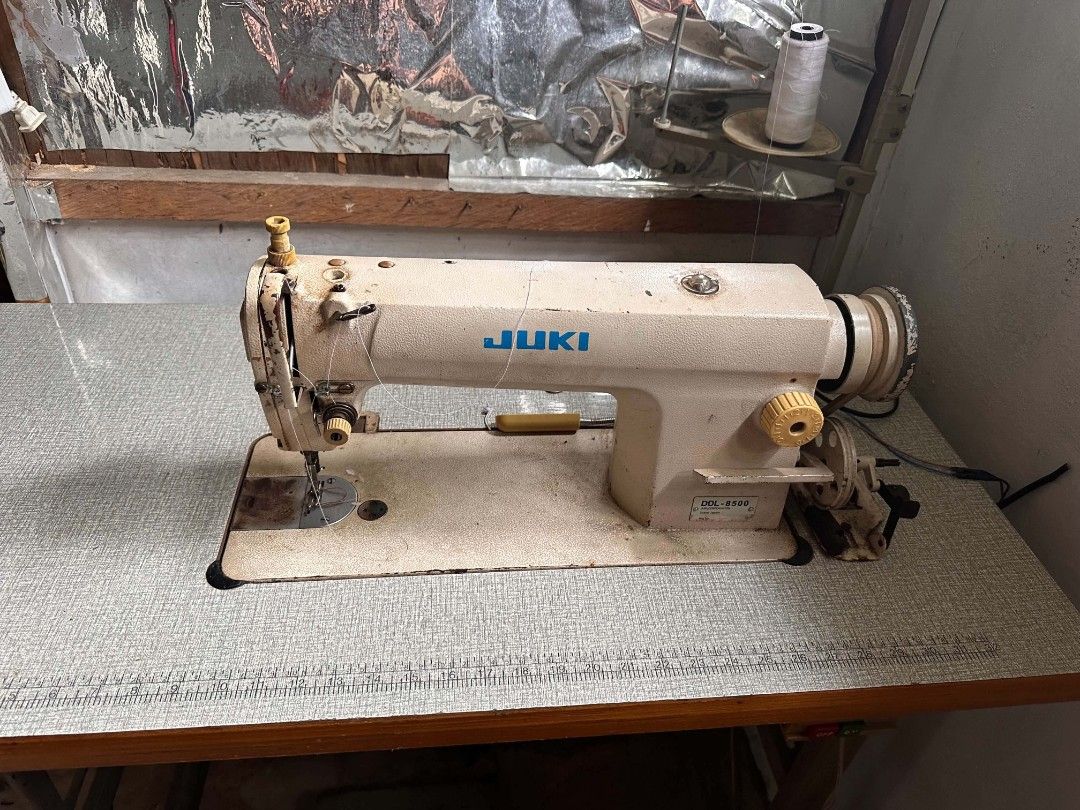 JUKI DDL-8500 Industrial Sewing Machine with Table (Category: Other Home Appliances) located in Manila. Submitted by monya111 (Listing ID 1461153694, Image 2). Description: - JUKI DDL-8500 Industrial Sewing Machine - Comes with a sturdy table - Includes foot pedal for easy operation - Pre-loaded with a spool of white thread - Perfect for all your sewing projects - Ready to go!.