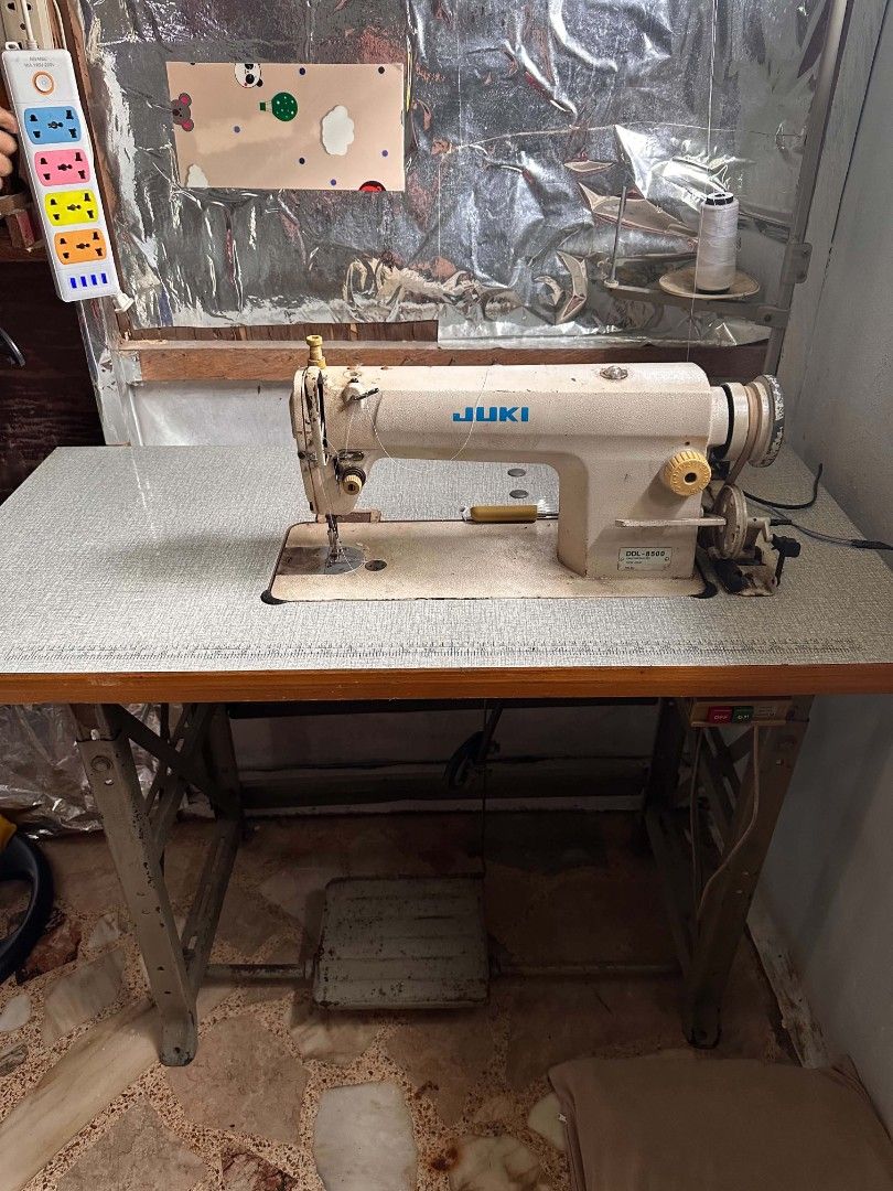 JUKI DDL-8500 Industrial Sewing Machine with Table (Category: Other Home Appliances) located in Manila. Submitted by monya111 (Listing ID 1461153694, Image 1). Description: - JUKI DDL-8500 Industrial Sewing Machine - Comes with a sturdy table - Includes foot pedal for easy operation - Pre-loaded with a spool of white thread - Perfect for all your sewing projects - Ready to go!.
