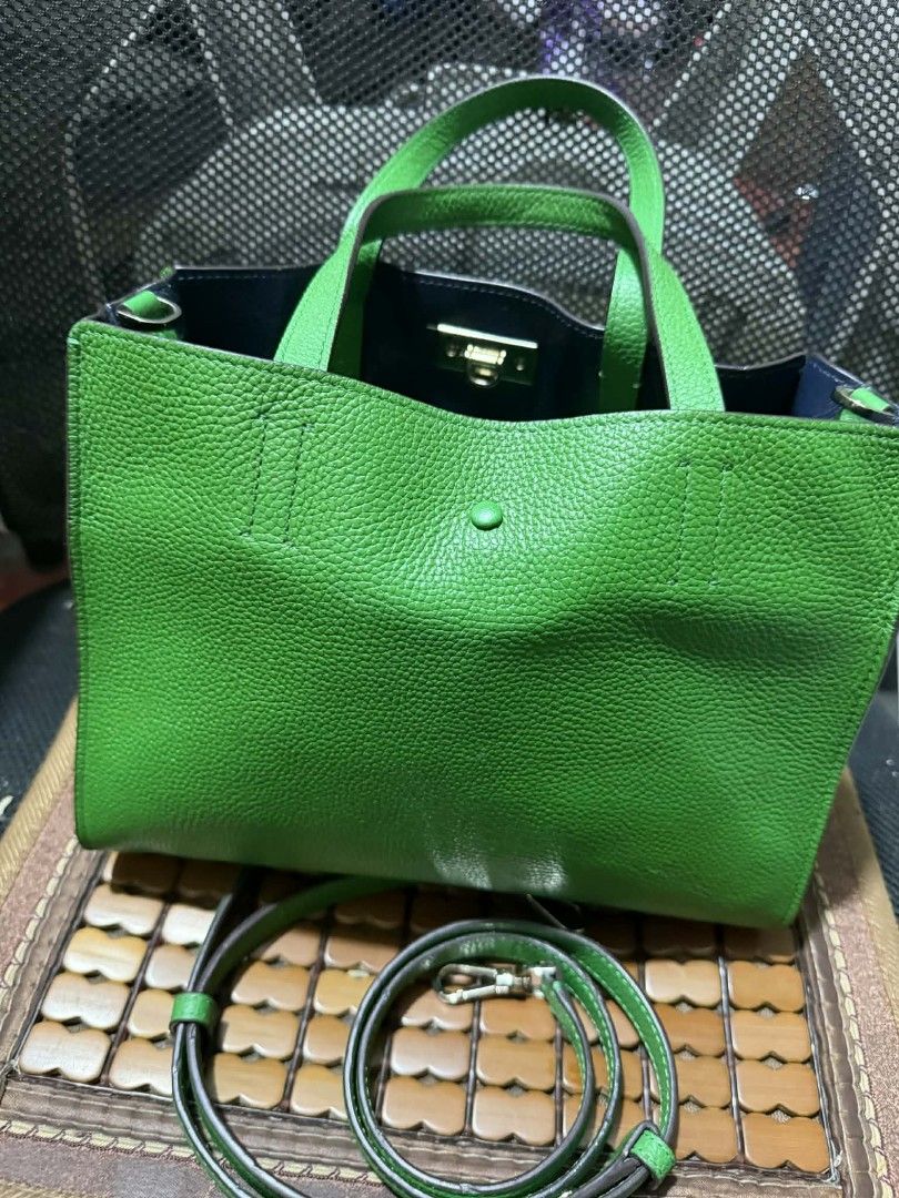 Kate Spade Green Leather Tote Bag with Strap (Category: Luxury Bags & Wallets) located in Manila. Submitted by cruznarlyn63507 (Listing ID 1461164159, Image 2). Description: Bright green Kate Spade tote bag in textured leather. Features top handles, a detachable crossbody strap, and a front snap closure. Navy blue interior with a green pouch. Perfect for everyday..
