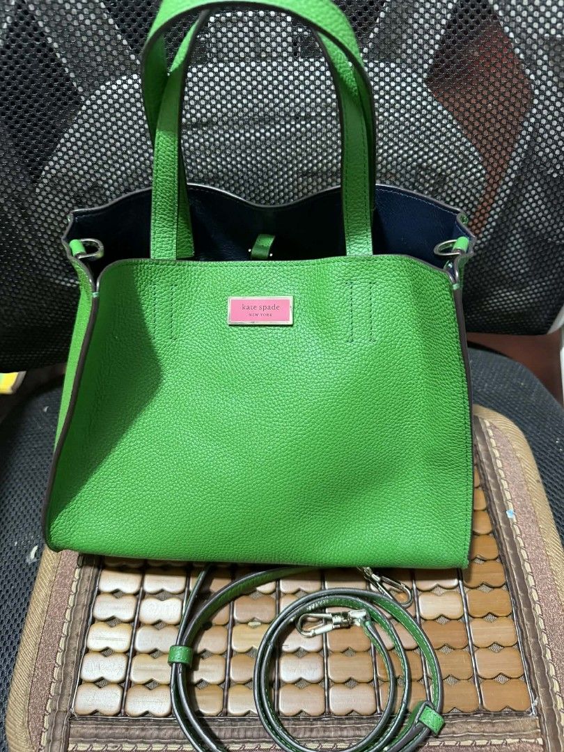 Kate Spade Green Leather Tote Bag with Strap (Category: Luxury Bags & Wallets) located in Manila. Submitted by cruznarlyn63507 (Listing ID 1461164159, Image 1). Description: Bright green Kate Spade tote bag in textured leather. Features top handles, a detachable crossbody strap, and a front snap closure. Navy blue interior with a green pouch. Perfect for everyday..