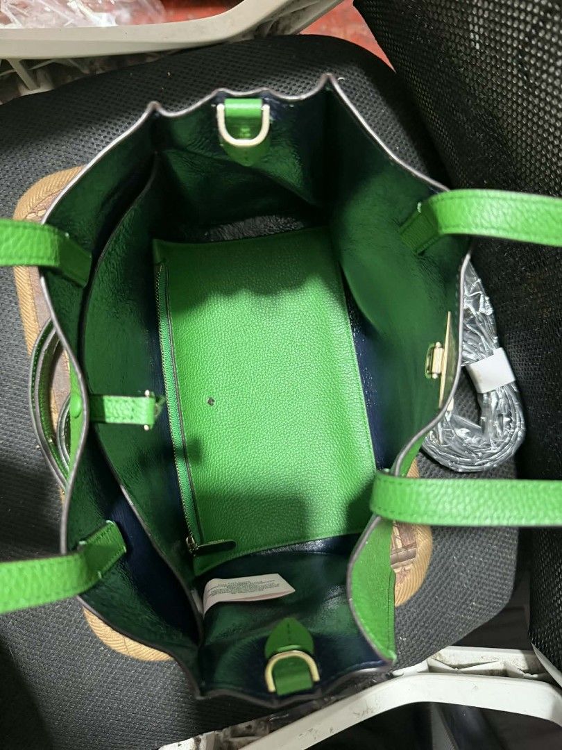 Kate Spade Green Leather Tote Bag with Strap (Category: Luxury Bags & Wallets) located in Manila. Submitted by cruznarlyn63507 (Listing ID 1461164159, Image 3). Description: Bright green Kate Spade tote bag in textured leather. Features top handles, a detachable crossbody strap, and a front snap closure. Navy blue interior with a green pouch. Perfect for everyday..