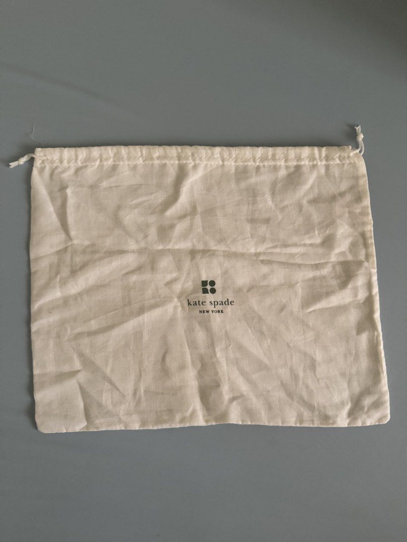 Kate Spade New York Dust Bag (Category: Purses & Pouches) located in Pasig City. Submitted by topbrandpursuits (Listing ID 1461145144, Image 1). Description: - Authentic Kate Spade New York dust bag - Cream color with classic logo - Secure drawstring closure - Ideal for protecting handbags or shoes - dimensions: 13 inches x 131inches.