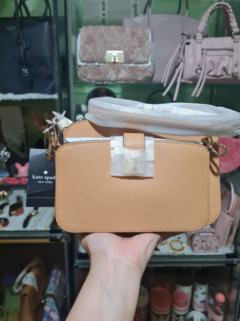 Kate Spadw turnlock crossbody duo (Category: Luxury Bags & Wallets) located in Quezon City. Submitted by luli_18 (Listing ID 1461243156, Image 2). Description: tiramisu color.