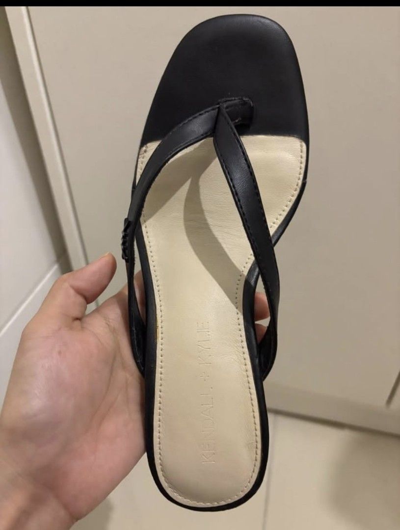 Kendall + Kylie Black Thong Heeled Sandals (Category: Heels) located in Manila. Submitted by aachii (Listing ID 1461147113, Image 3). Description: - Brand: Kendall + Kylie - Only Black heels is available - Style: Black Heeled Thong Sandals - Features: Square toe, unique stacked heel - Comfort: Comfortable for everyday wear - No box and paper bag - Perfect for: Adding to your shoe collection.