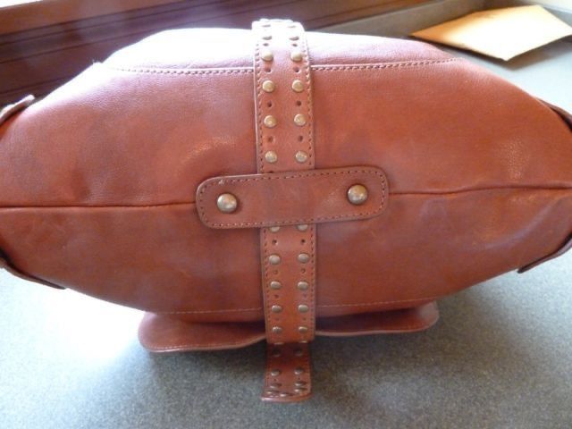Kooba USA leather brown studs bag (Category: Shoulder Bags) located in Marikina City. Submitted by minimalistmanila (Listing ID 1461132198, Image 3). Description: Genuine Kooba caramel brown shoulder bag purchased in Florida USA. Size is M/L. Heavy duty as made from real leather with metal studs. Funky style. Invest in a good heavy duty bag now. -Needs cleaning as kept in storage. Get this now!.