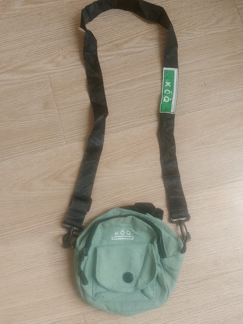 KOQ Canvas Crossbody Bag - Light Green (Category: Sling Bags) located in Santa Rosa. Submitted by 3kthriftstore (Listing ID 1461276113, Image 1). Description: - Cute light green canvas crossbody bag from KOQ. - Main zip compartment for secure storage. - Front pocket with button closure for easy access. - Adjustable strap for a comfortable fit. - Small and compact, ideal for everyday use or travel. Condition 9/10.