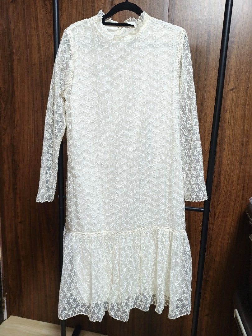 Lace Embroid midi dress (Category: Dresses) located in Baguio. Submitted by PreiLoveMaria (Listing ID 1461219919, Image 2). Description: Elegant cream/off-white lace midi dress featuring an all-over delicate floral embroidered pattern, long sheer sleeves, a chic high ruffle neckline, and a playful tiered drop-waist hem with a scalloped edge. It is fully lined through the body and has a concealed back zipper closure for a clean, polished finish. ​