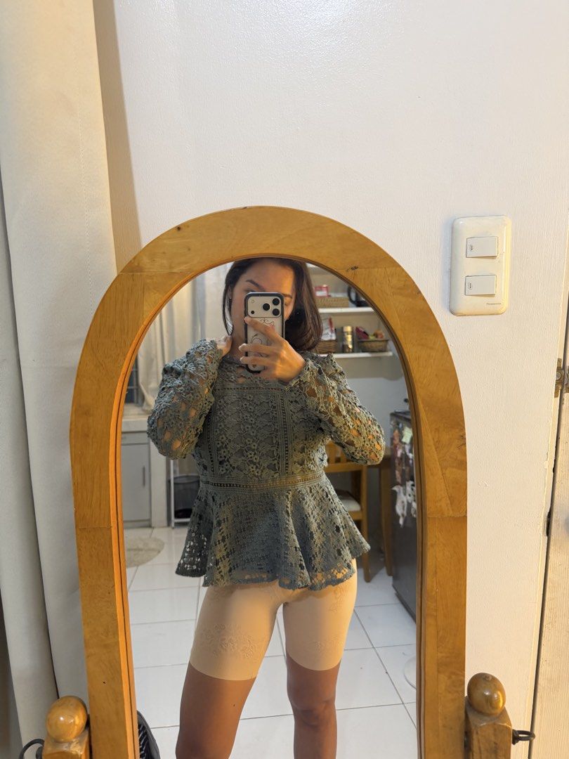Lace Peplum Top with High Neck (Category: Sleeveless) located in Mandaluyong City. Submitted by chocofudge__ (Listing ID 1461151444, Image 2). Description: - Chic grey lace peplum top - Features a sophisticated high neck and long sleeves - Intricate lace detailing all over - Flattering peplum silhouette - Versatile for dressing up or down - Ideal for parties, dates, or a night out.