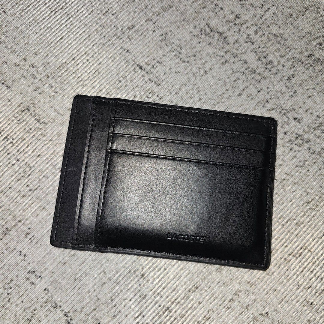 Lacoste Black Leather Cardholder (Category: Wallets & Card Holders) located in Palayan City. Submitted by rvllssx (Listing ID 1461146455, Image 2). Description: - Authentic Lacoste black leather cardholder - Slim design, fits easily in pockets - Multiple card slots inside - Minimalist and stylish - Ideal for carrying your essential cards.