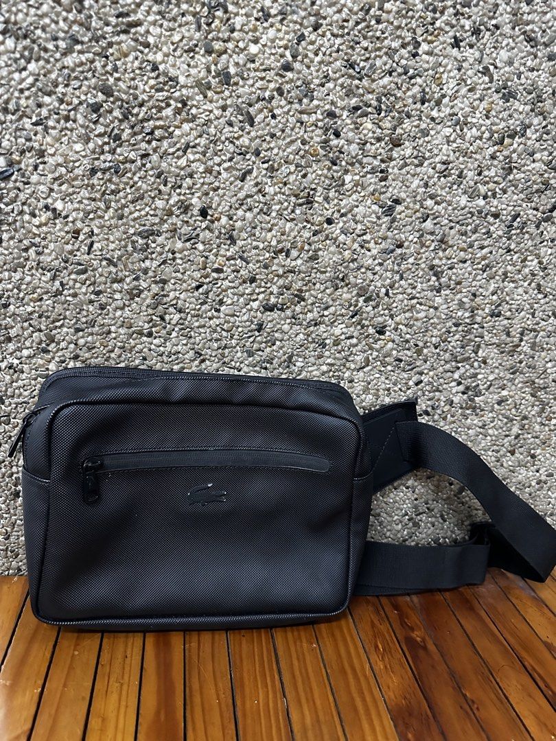 Lacoste Black Nylon Sling Bag (Category: Sling Bags) located in Manila. Submitted by aisasalvad24335 (Listing ID 1461157177, Image 1). Description: - Authentic Black Lacoste Sling Bag - Durable Nylon Material - Main Zippered Compartment - Front Zippered Pocket - Adjustable Strap for Comfort - Ideal for Everyday Use or Travel - Clean Interior.