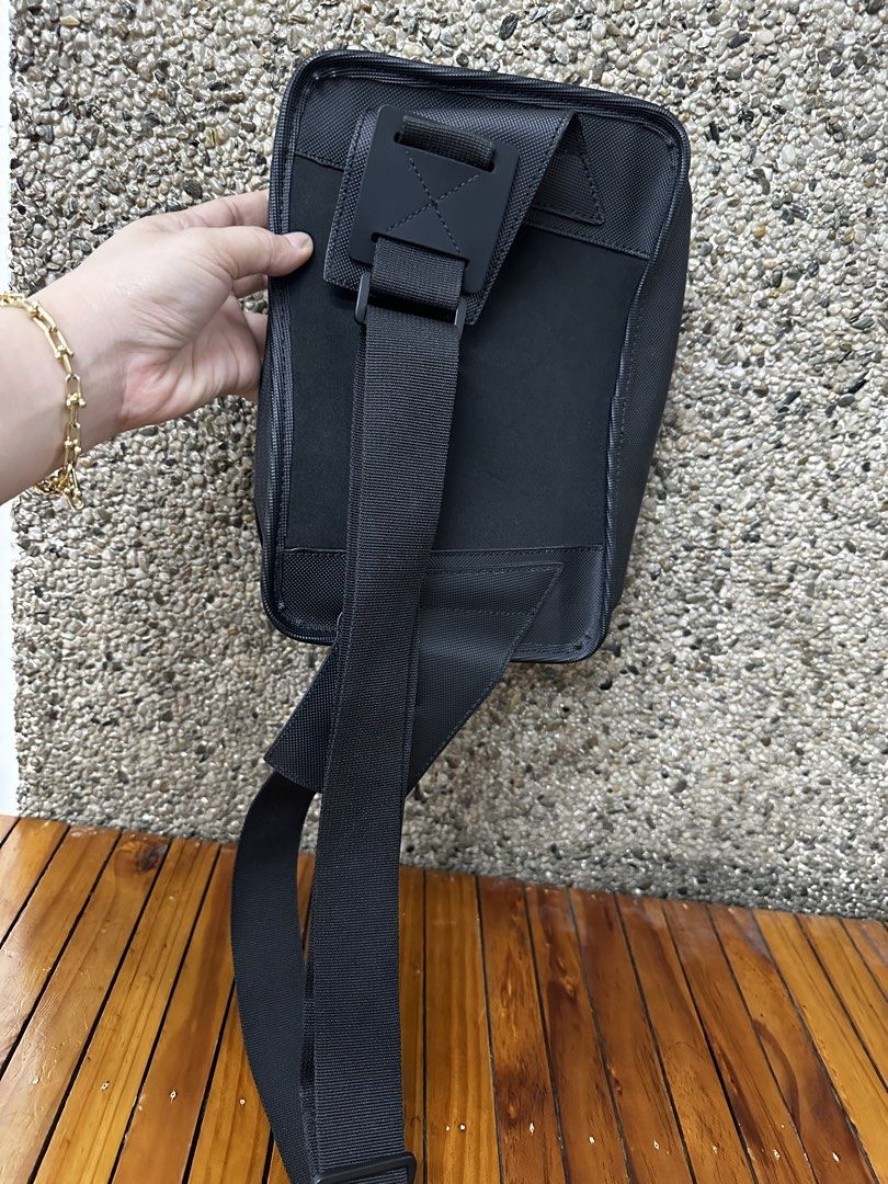 Lacoste Black Nylon Sling Bag (Category: Sling Bags) located in Manila. Submitted by aisasalvad24335 (Listing ID 1461157177, Image 3). Description: - Authentic Black Lacoste Sling Bag - Durable Nylon Material - Main Zippered Compartment - Front Zippered Pocket - Adjustable Strap for Comfort - Ideal for Everyday Use or Travel - Clean Interior.