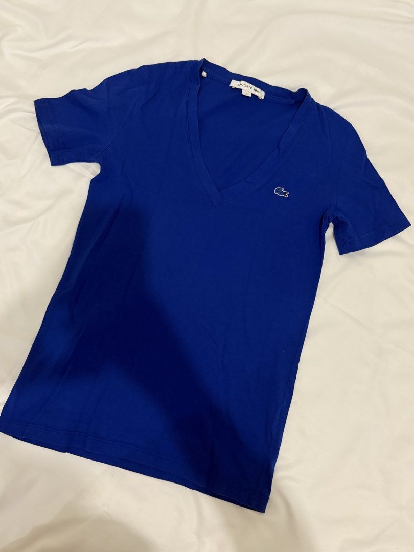 Lacoste Blue V-Neck T-Shirt (Category: Tshirts & Polo Shirts ) located in Manila. Submitted by t_a_s_h (Listing ID 1461221483, Image 1). Description: - size 32 - never been used.