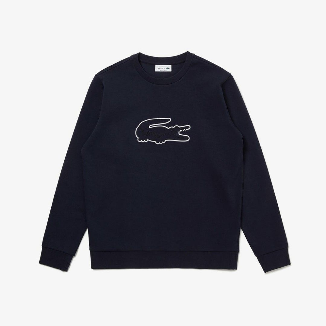 Lacoste navy blue crewneck sweatshirt (Category: Coats, Jackets and Outerwear) located in Paranaque City. Submitted by nvdluxurygoods (Listing ID 1461219060, Image 1). Description: This is a dark navy blue Lacoste crewneck sweatshirt featuring a large outline embroidered crocodile logo on the chest. ready to ship maganda 10/10 no flaws, no issue.
