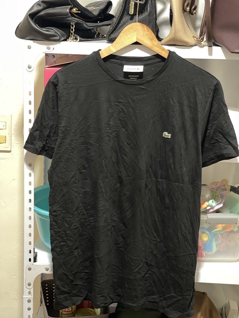 Lacoste Plain Black shirt chest logo M (Category: Shirts) located in Marikina City. Submitted by joshuaades21107 (Listing ID 1461292622, Image 1). Description: -Lacoste shirt -100% cotton -Medium fit Dimension: 21 w 26 l 10/10 color rate and condition.