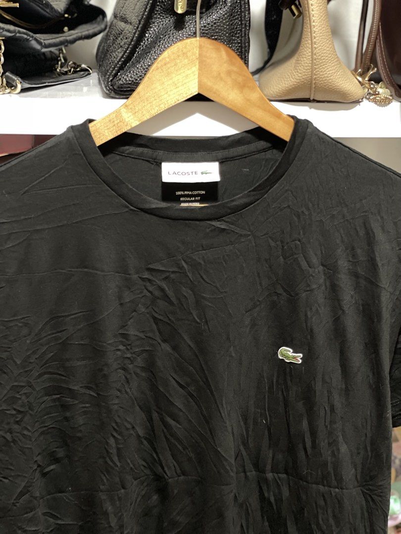 Lacoste Plain Black shirt chest logo M (Category: Shirts) located in Marikina City. Submitted by joshuaades21107 (Listing ID 1461292622, Image 2). Description: -Lacoste shirt -100% cotton -Medium fit Dimension: 21 w 26 l 10/10 color rate and condition.