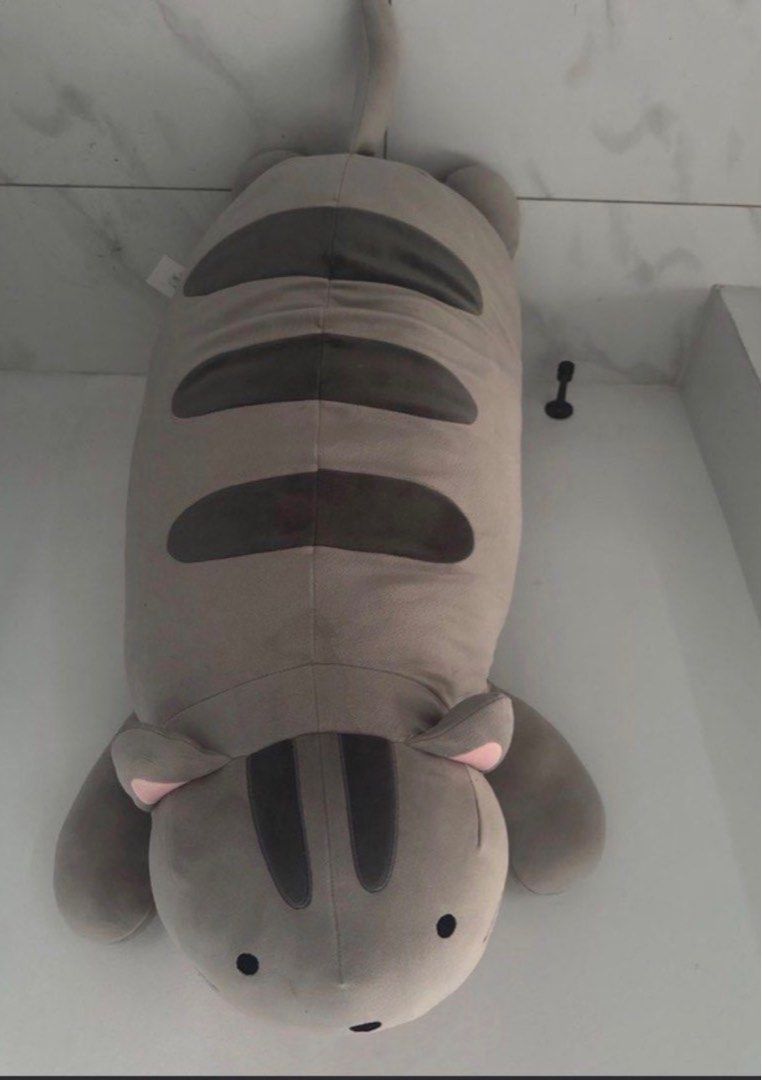 Large Grey Striped Cat Plush Pillow (Category: Bedding & Towels) located in Manila. Submitted by decluterthings888 (Listing ID 1461138150, Image 1). Description: - Super cute and squishy plush cat pillow - Large size, perfect for hugging and cuddling - Classic grey color with dark stripes - Soft and pleasant to touch - Great as a room decoration - Ideal gift for kids or cat lovers.