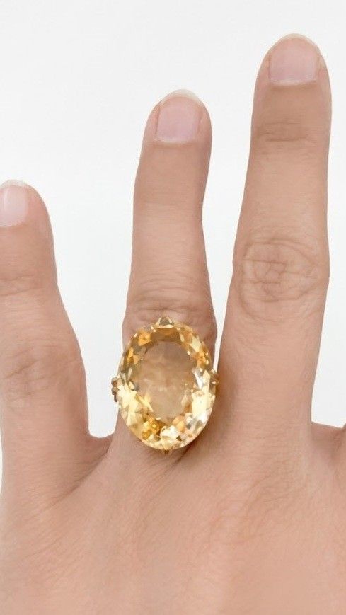 Large Oval Citrine Gemstone Ring in Gold Setting (Category: Rings) located in Marikina City. Submitted by dgoldhub (Listing ID 1461180254, Image 1). Description: - Beautiful large oval-cut citrine gemstone - Warm, honey-yellow hue - Set in classic gold-tone metal - Statement ring, perfect for adding a pop of color - Lovely addition to any jewelry collection - 18k, Size 5.