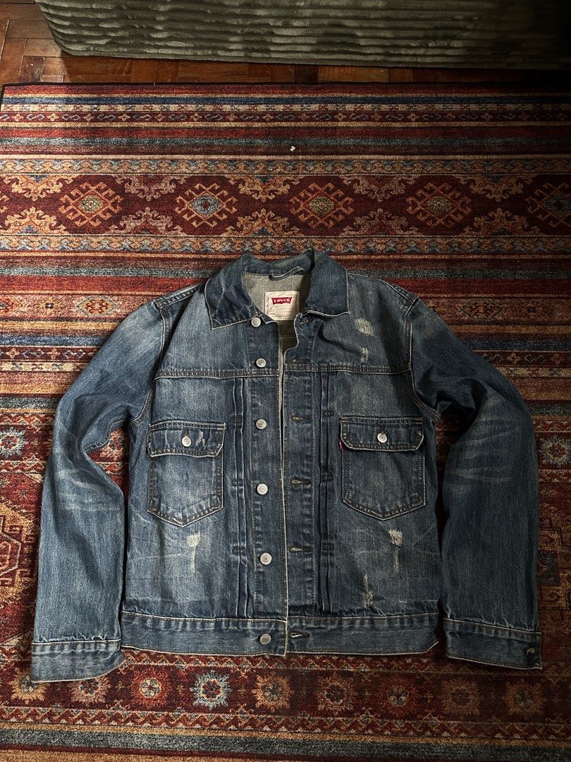 Levi's Denim Jacket Blue Distressed Trucker Style (Category: Coats, Jackets and Outerwear) located in Manila. Submitted by margaretta89487 (Listing ID 1461218150, Image 1). Description: Width: 30-31 L- 32 Classic Levi's denim jacket - Blue wash with distressed details - Two chest pockets with button closures - Button front and cuffs - Standard trucker jacket fit - Ideal for layering.