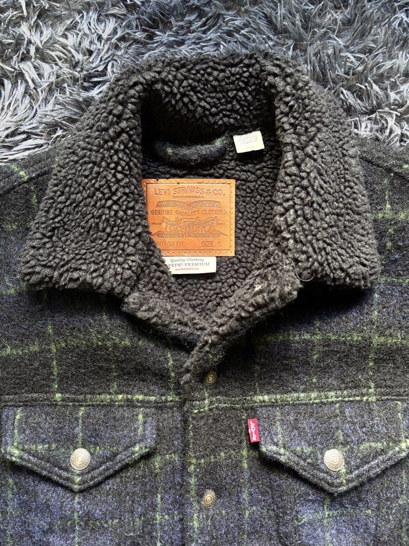 Levi's Sherpa Lined Plaid Trucker Jacket (Category: Coats, Jackets and Outerwear) located in Baguio. Submitted by kurt_7 (Listing ID 1461127449, Image 2). Description: - Classic Levi's trucker jacket - Navy and green plaid pattern - Cozy sherpa lining for warmth - Button-up front with chest pockets - Ideal for cooler weather - Size: S.