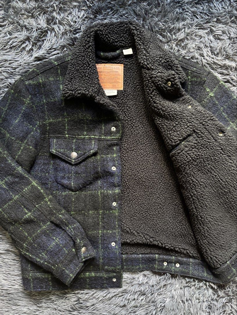 Levi's Sherpa Lined Plaid Trucker Jacket (Category: Coats, Jackets and Outerwear) located in Baguio. Submitted by kurt_7 (Listing ID 1461127449, Image 1). Description: - Classic Levi's trucker jacket - Navy and green plaid pattern - Cozy sherpa lining for warmth - Button-up front with chest pockets - Ideal for cooler weather - Size: S.