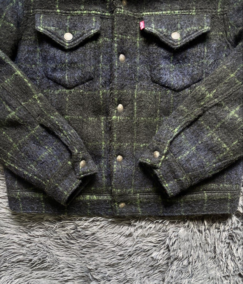 Levi's Sherpa Lined Plaid Trucker Jacket (Category: Coats, Jackets and Outerwear) located in Baguio. Submitted by kurt_7 (Listing ID 1461127449, Image 3). Description: - Classic Levi's trucker jacket - Navy and green plaid pattern - Cozy sherpa lining for warmth - Button-up front with chest pockets - Ideal for cooler weather - Size: S.