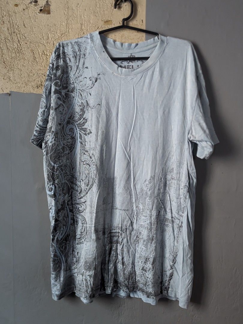 Light Blue Graphic Print T-Shirt (Category: Tshirts & Polo Shirts ) located in Manila. Submitted by andreiming84756 (Listing ID 1461191761, Image 1). Description: - Light blue t-shirt - Cool grey vintage/distressed graphic print on front and sleeves - Crew neck, short sleeves - Perfect for casual everyday wear.