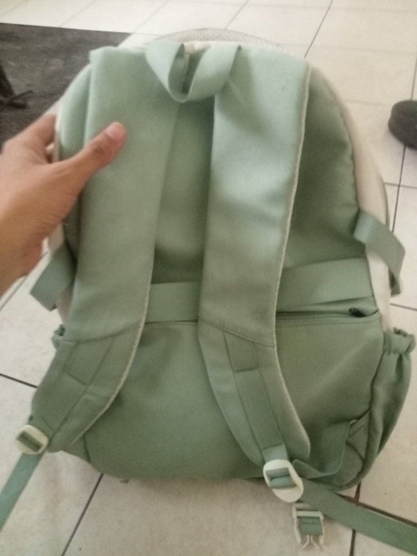 Light Green and Cream Backpack (Category: Luxury Bags & Wallets) located in Calamba. Submitted by aaronlualhati (Listing ID 1461256181, Image 2). Description: - Adorable light green and cream backpack - Features multiple front pockets and side pouches - Adjustable straps for a comfortable fit - Smooth-working zippers for easy access - Ample interior space for your essentials - Ideal for school, work, or everyday adventures.